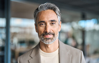 Close up headshot portrait of happy middle aged older professional business man, smiling bearded mature executive ceo manager, older male entrepreneur, rich confident business owner in office.